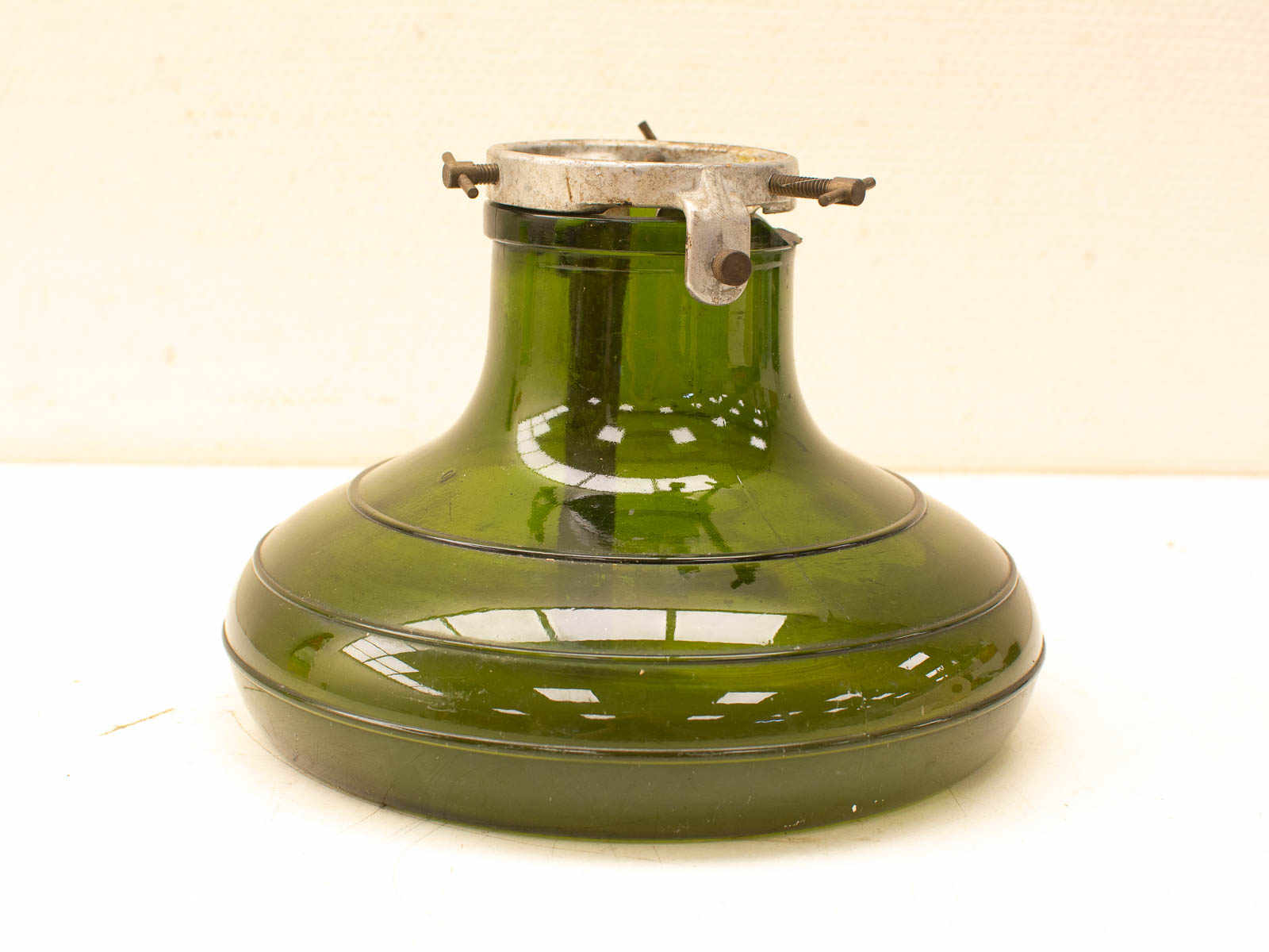 Elegant vintage green glass oil lamp with glossy finish, perfect for decor and functional use.