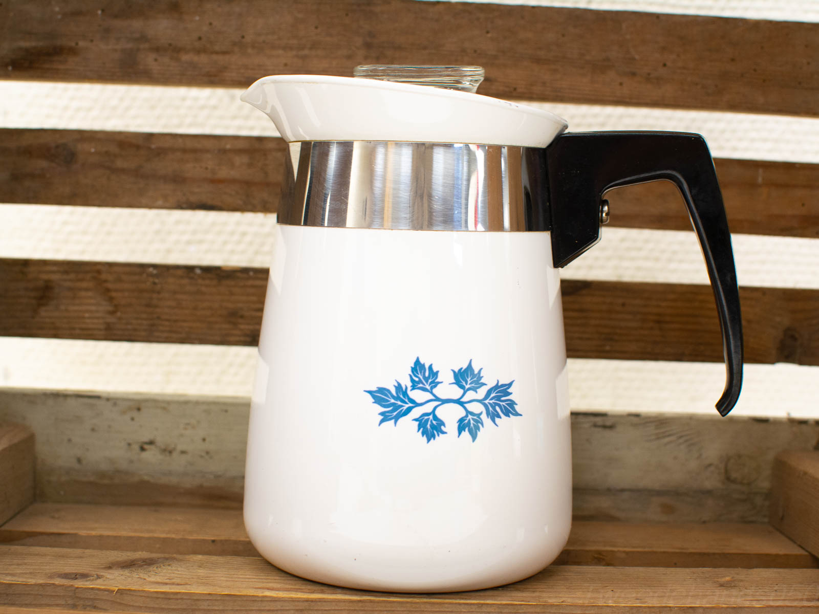 Charming vintage coffee pot with blue floral design and stainless steel accents for a nostalgic touch.