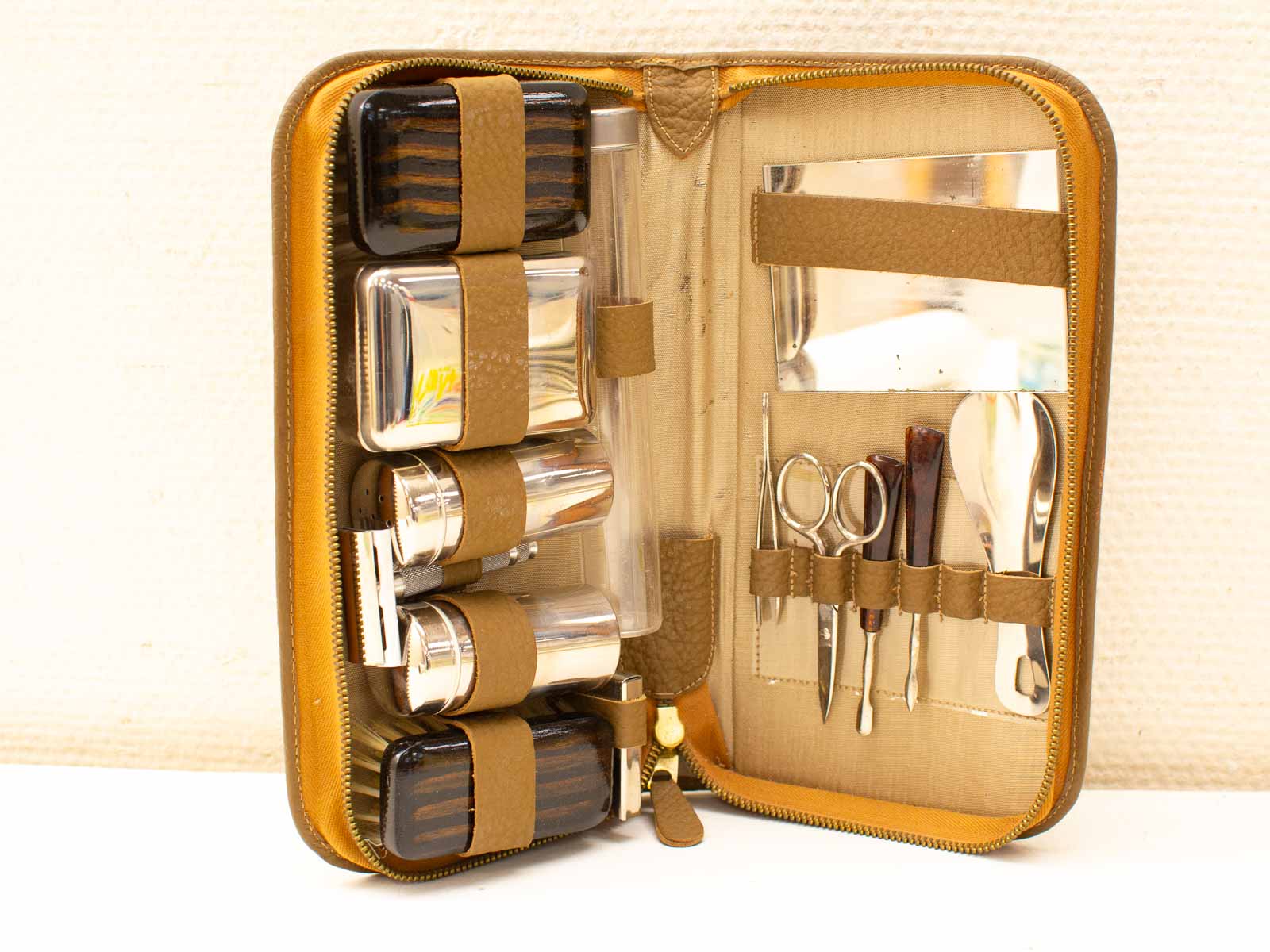 Elegant vintage toiletry case with luxurious grooming tools and organized compartments for personal care.