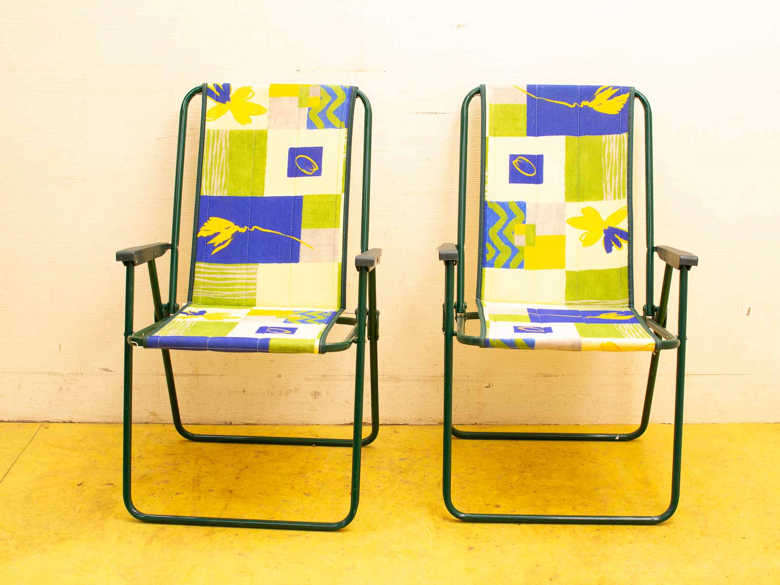 Colorful vintage folding chairs for stylish indoor and outdoor relaxation.