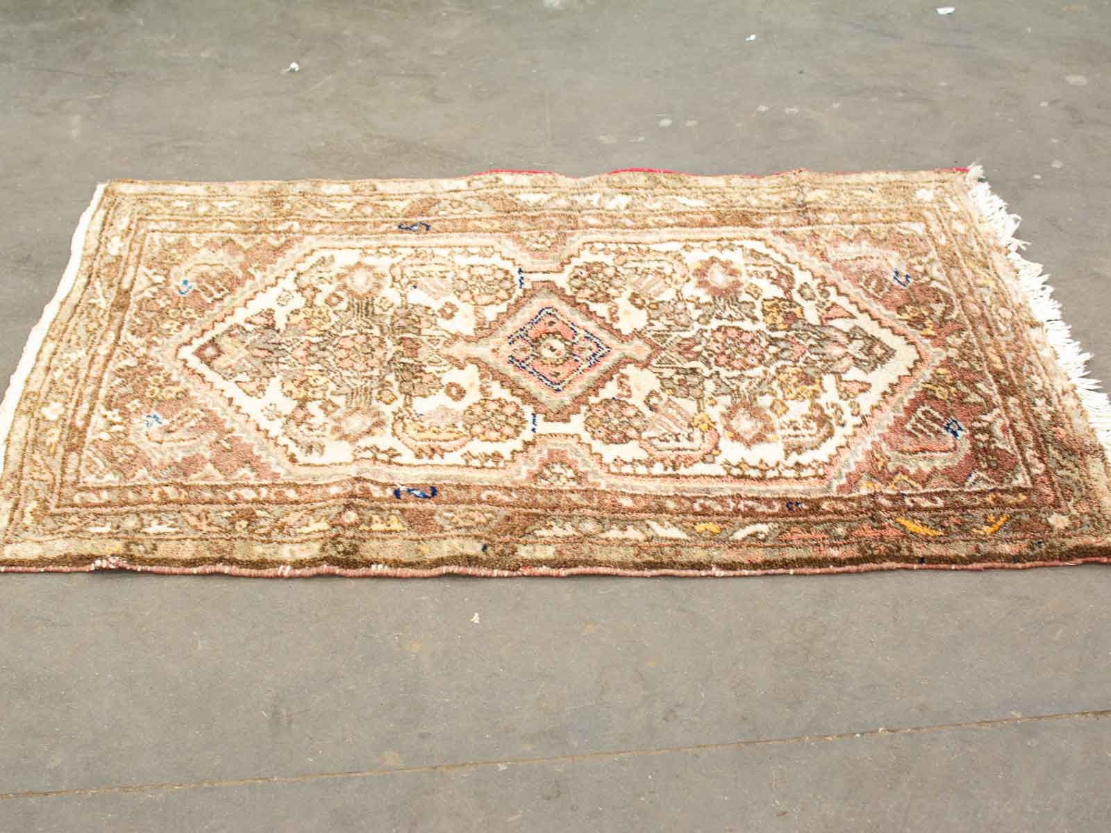 Elegant vintage rug with intricate patterns and warm colors, perfect for any interior décor.