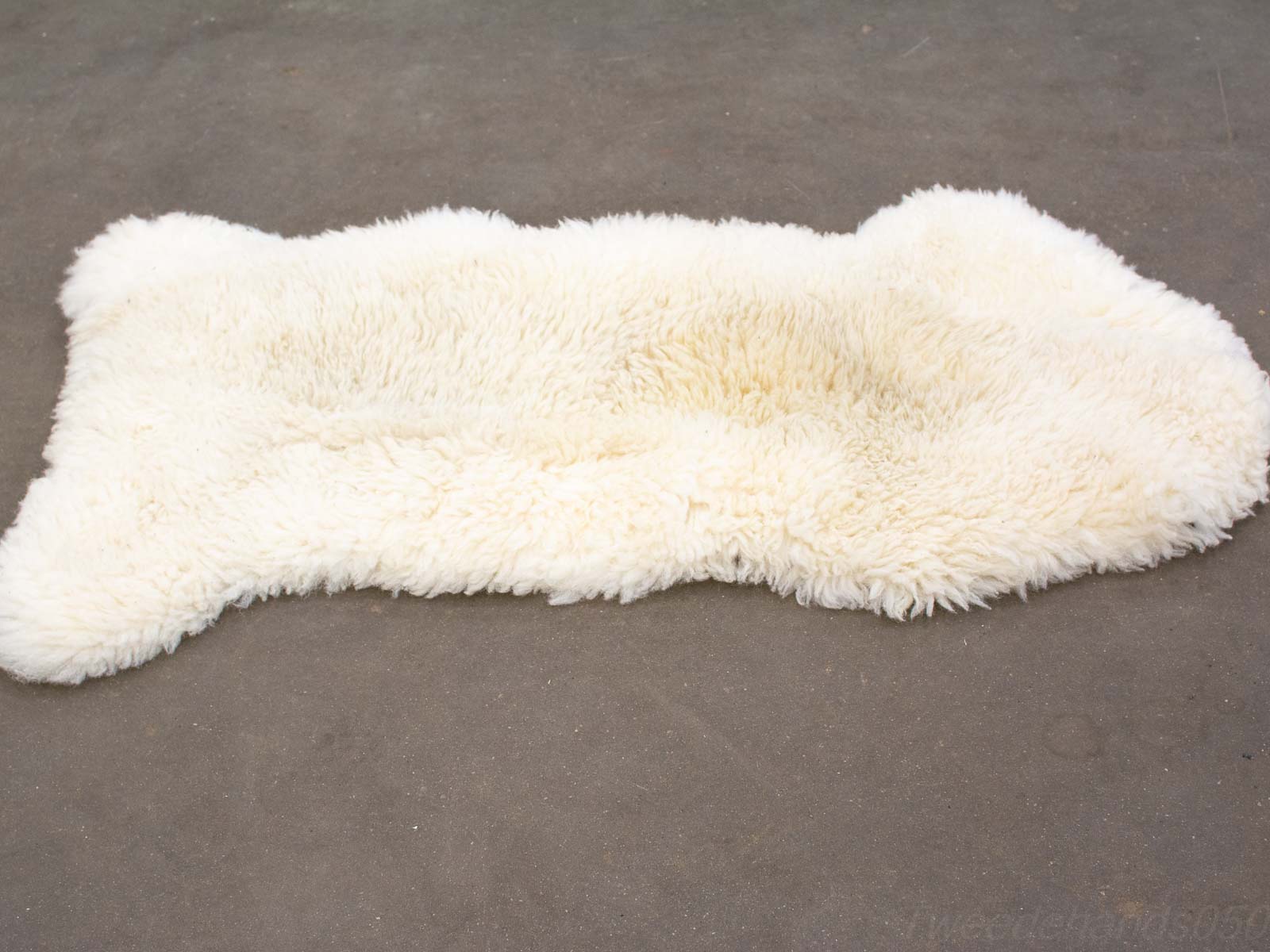 Cozy cream wool rug with fluffy texture and rustic charm for stylish home decor.