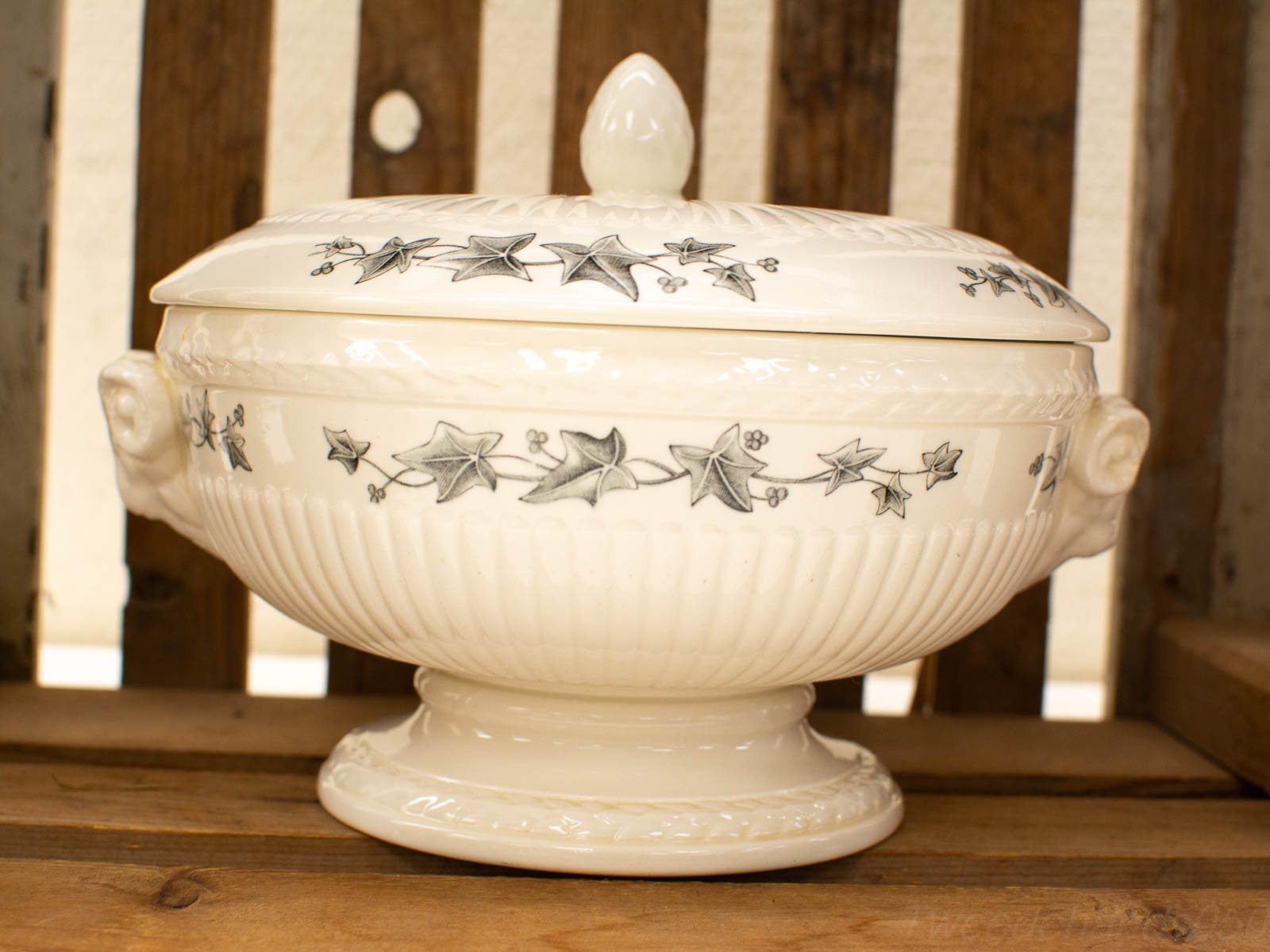 Elegant vintage ceramic tureen with ivy design and whimsical animal head handles.