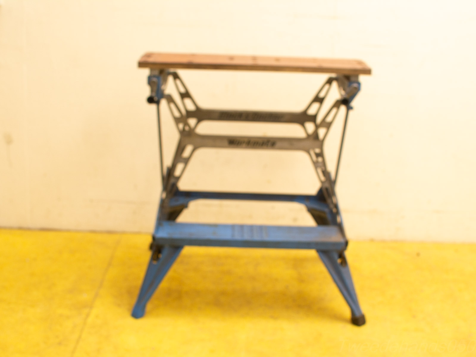 Modern vintage workbench combining wood and metal for stylish, functional woodworking and construction tasks.