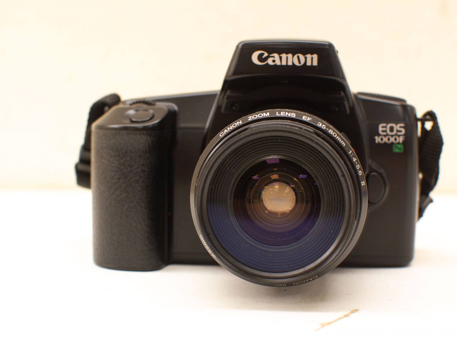 Classic Canon EOS 1000F vintage film camera with versatile EF 35-80mm zoom lens.