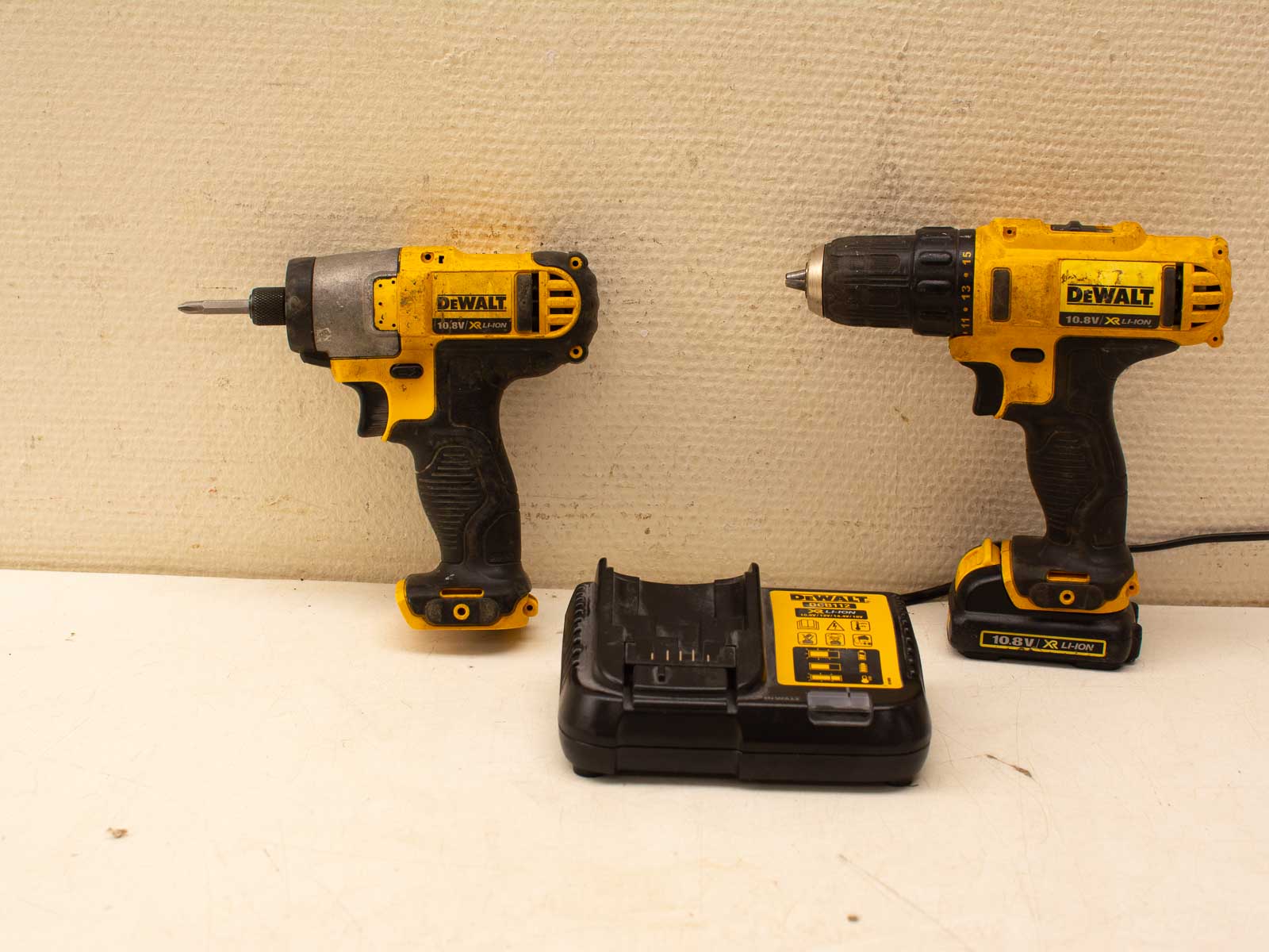 DeWalt impact driver and cordless drill set with charger for efficient DIY and professional tasks.