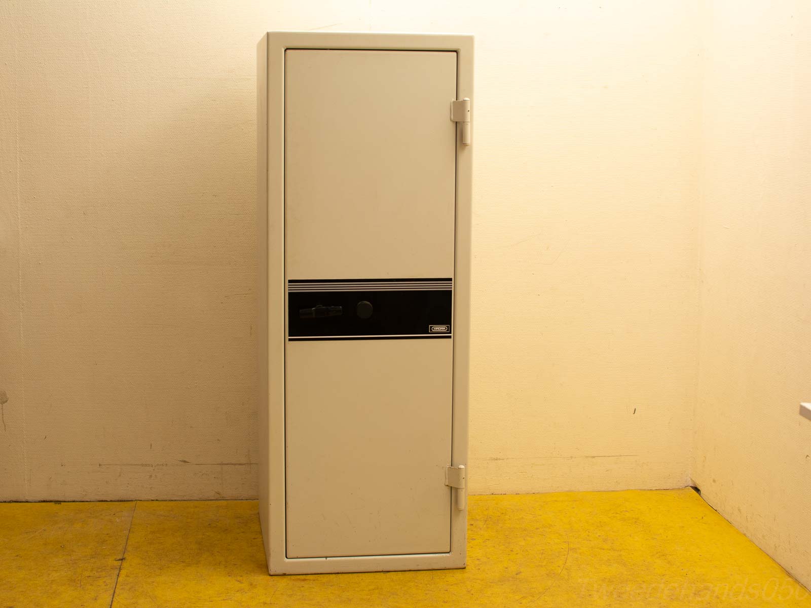 Sleek white safe with minimalist design, secure locking, ideal for modern interiors.