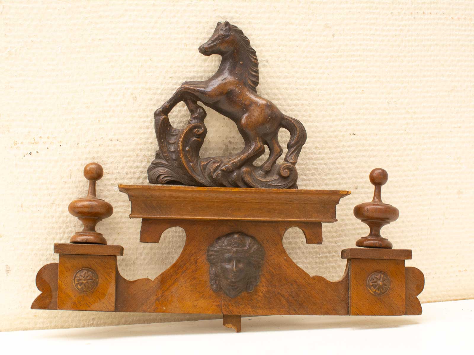 Elegant wooden horse sculpture with mythical face, perfect for vintage decor enhancement.