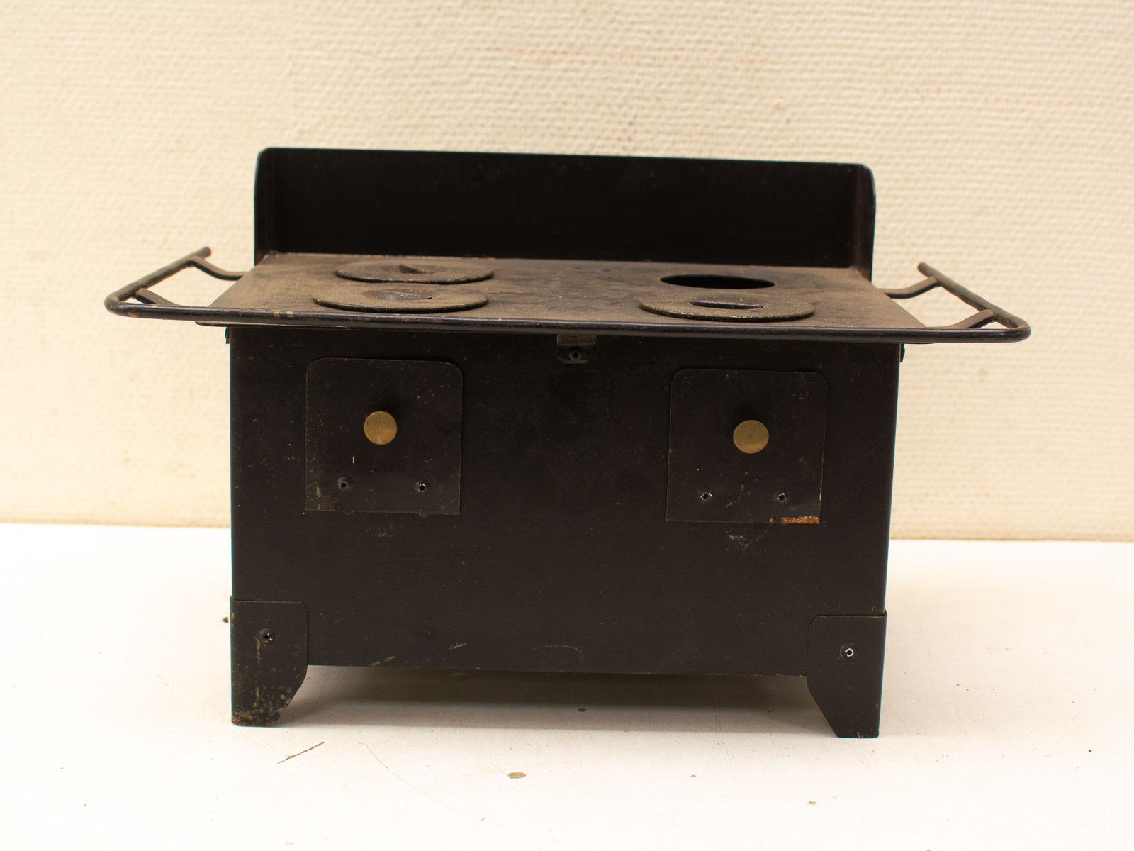 Classic vintage black stove with cast iron burners, showcasing nostalgia and durability for timeless kitchens.