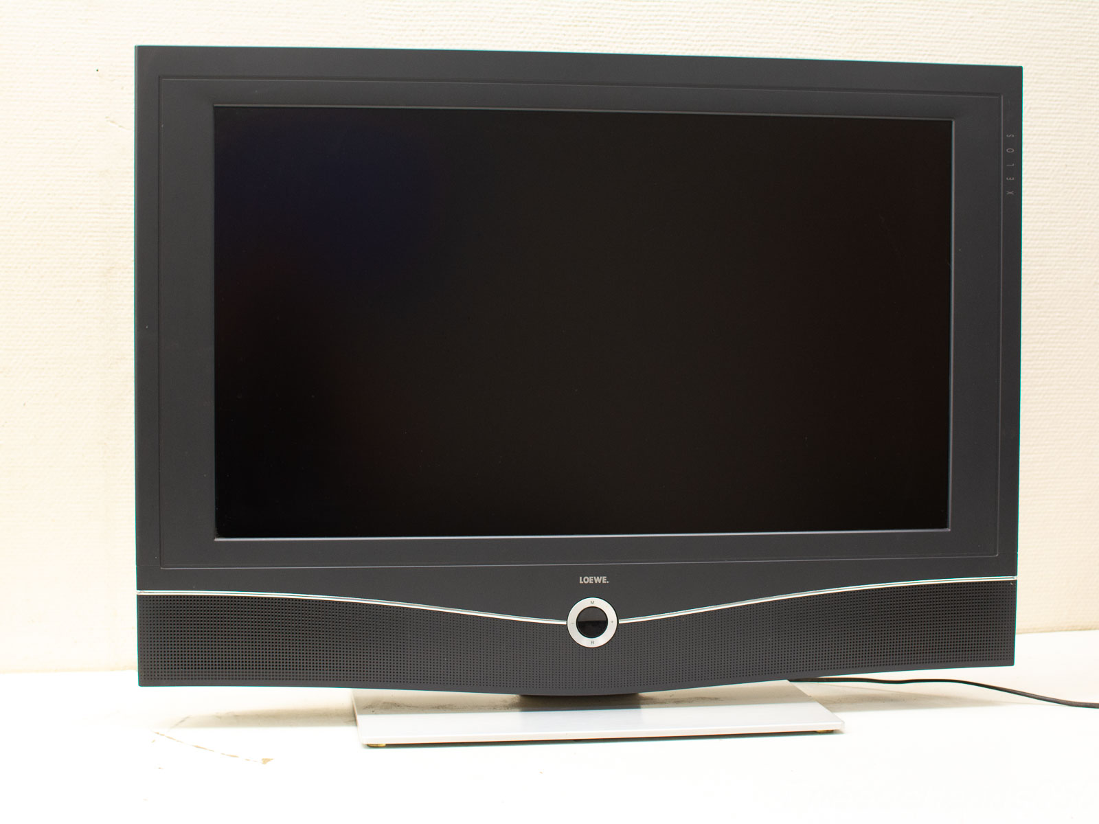 Sleek modern flat-screen TV with elegant design, perfect for contemporary living spaces.