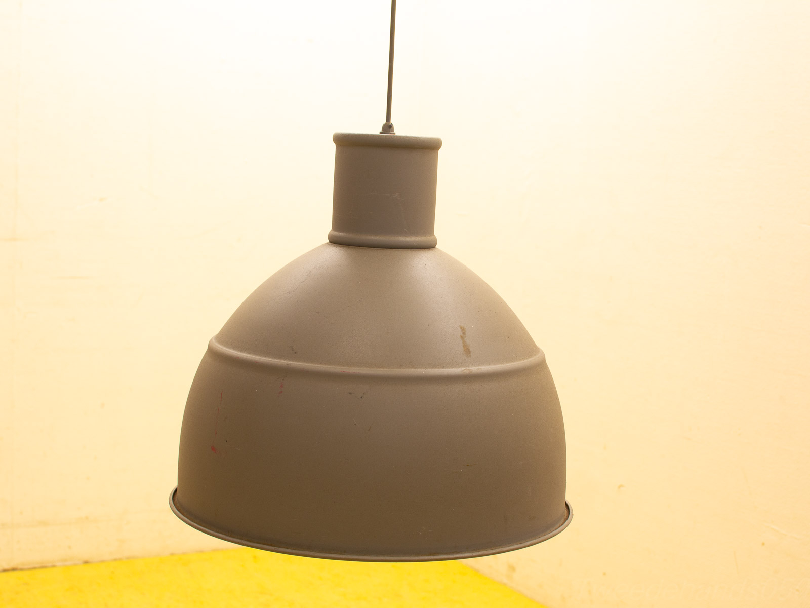 Vintage industrial gray pendant lamp with warm light, perfect for modern and retro interiors.