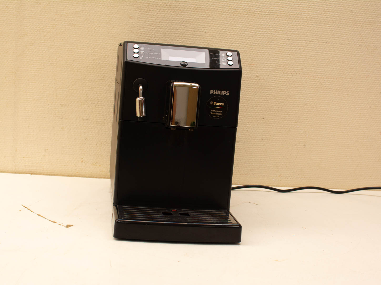 Sleek black coffee machine with digital display, designed for stylish convenience in any space.