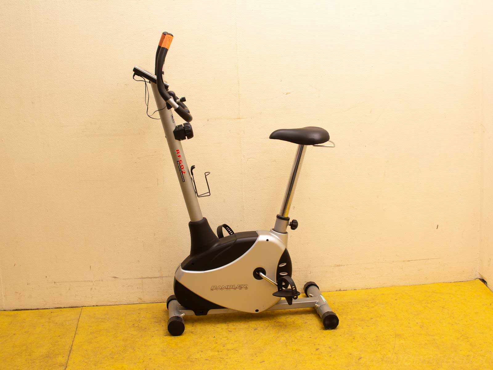 Sleek silver and black stationary exercise bike for effective indoor workouts at home.