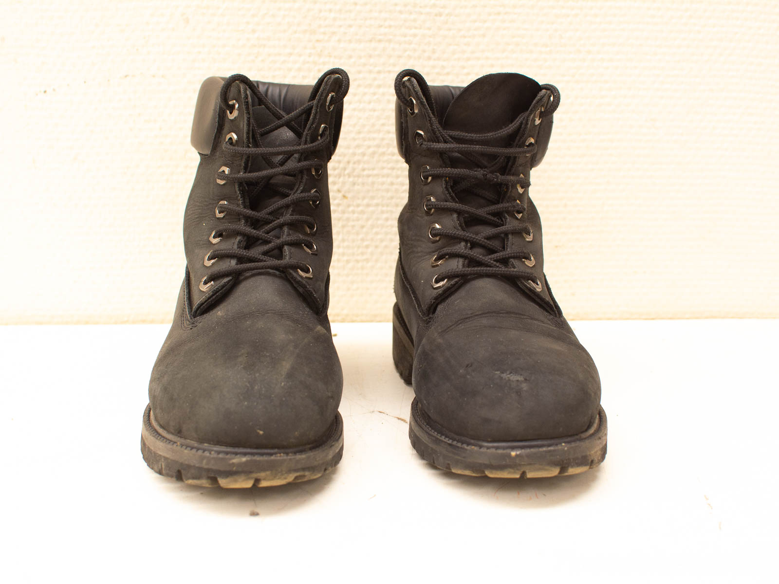 Rugged vintage black leather boots for outdoor adventures, offering durability, comfort, and excellent traction.