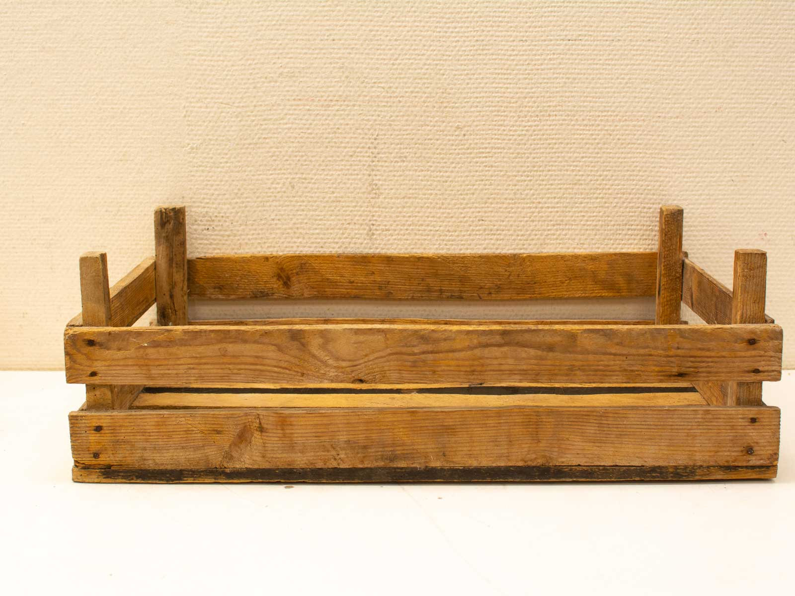 Rustic wooden crate with natural finish, perfect for storage and decorative use in any setting.