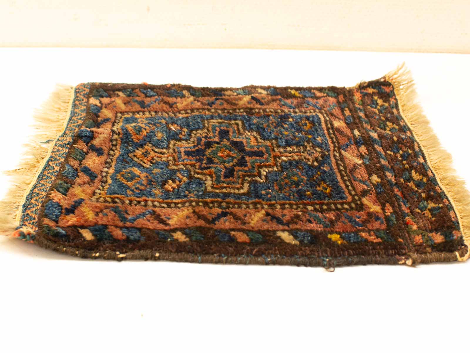 Vintage geometric tapestry rug with vibrant colors and intricate patterns, perfect for any interior.