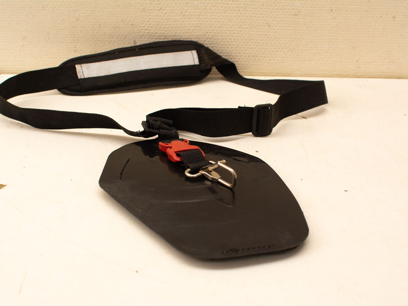 Durable water sports accessory with adjustable harness and secure clip for kayaking and windsurfing.