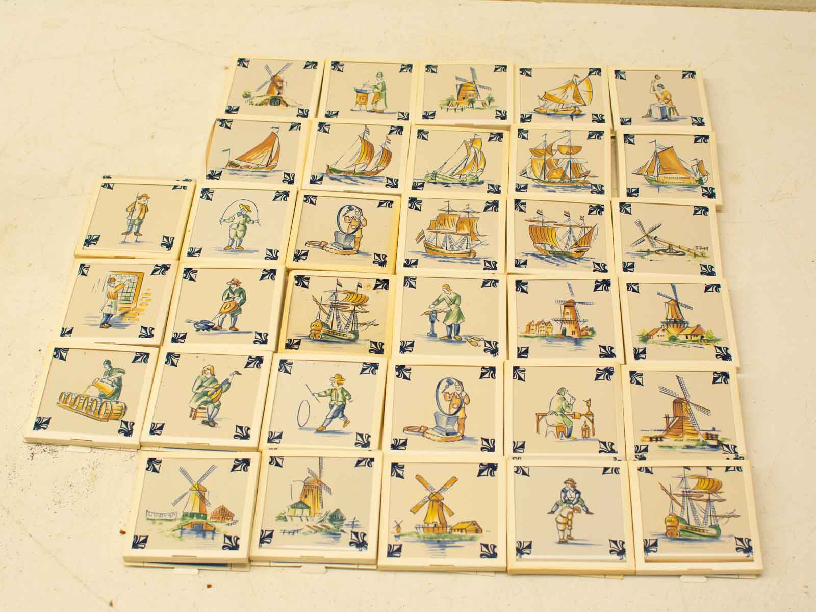 Vintage maritime ceramic tiles featuring colorful Dutch scenes of sailing and countryside life.