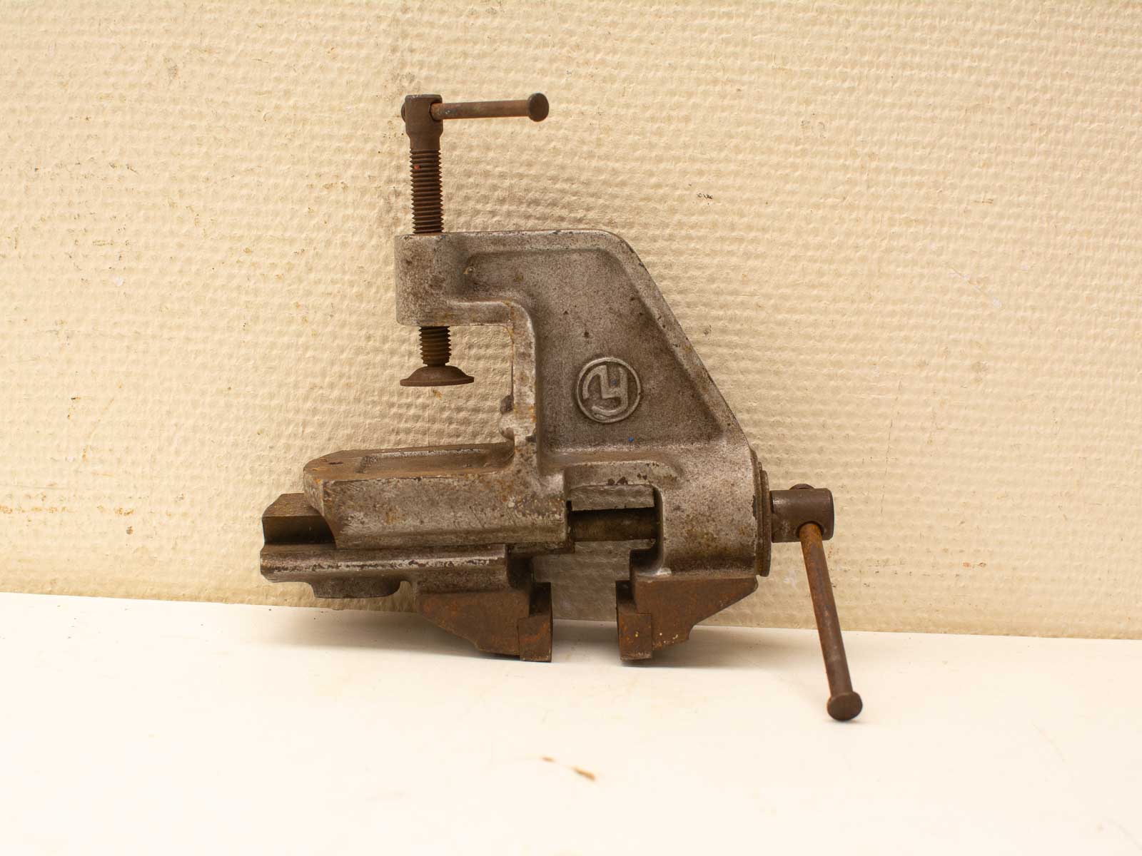 Vintage bench vise with rustic finish, showcasing durability and craftsmanship from years of use.