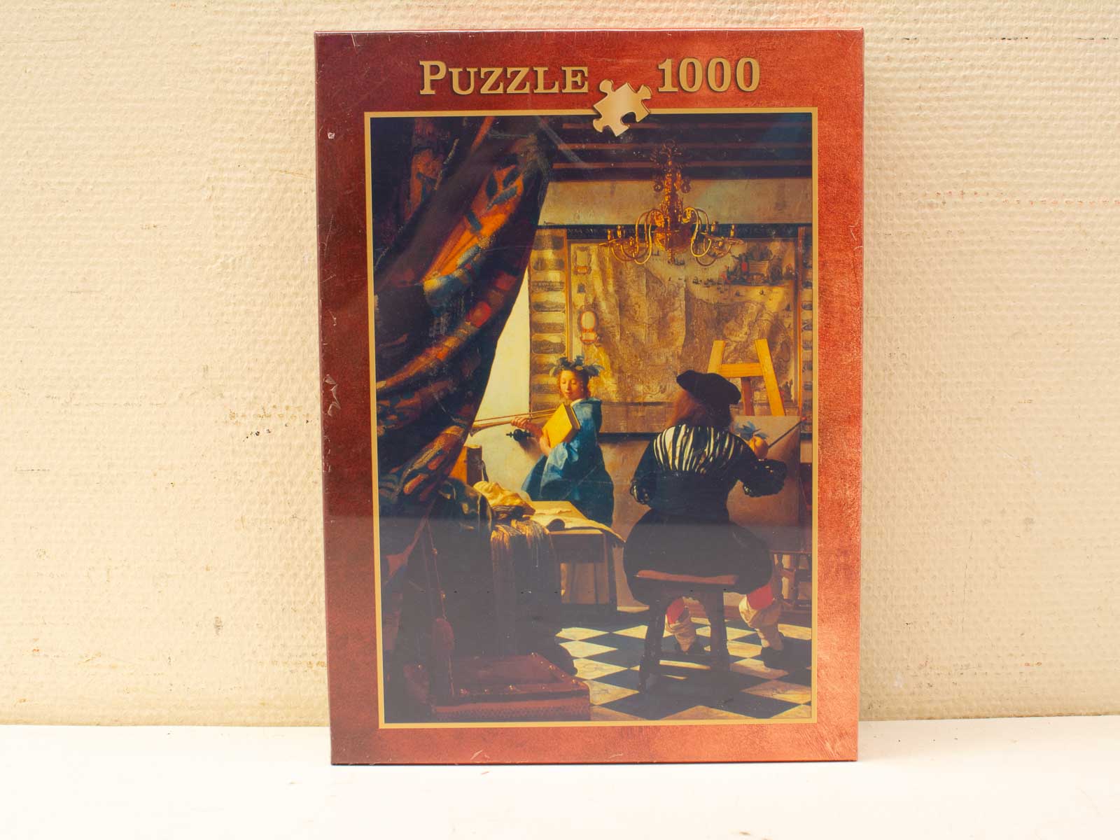 Jigsaw puzzel van een artistiek atelier met historische figuren en kleurrijke kunstbenodigdheden.