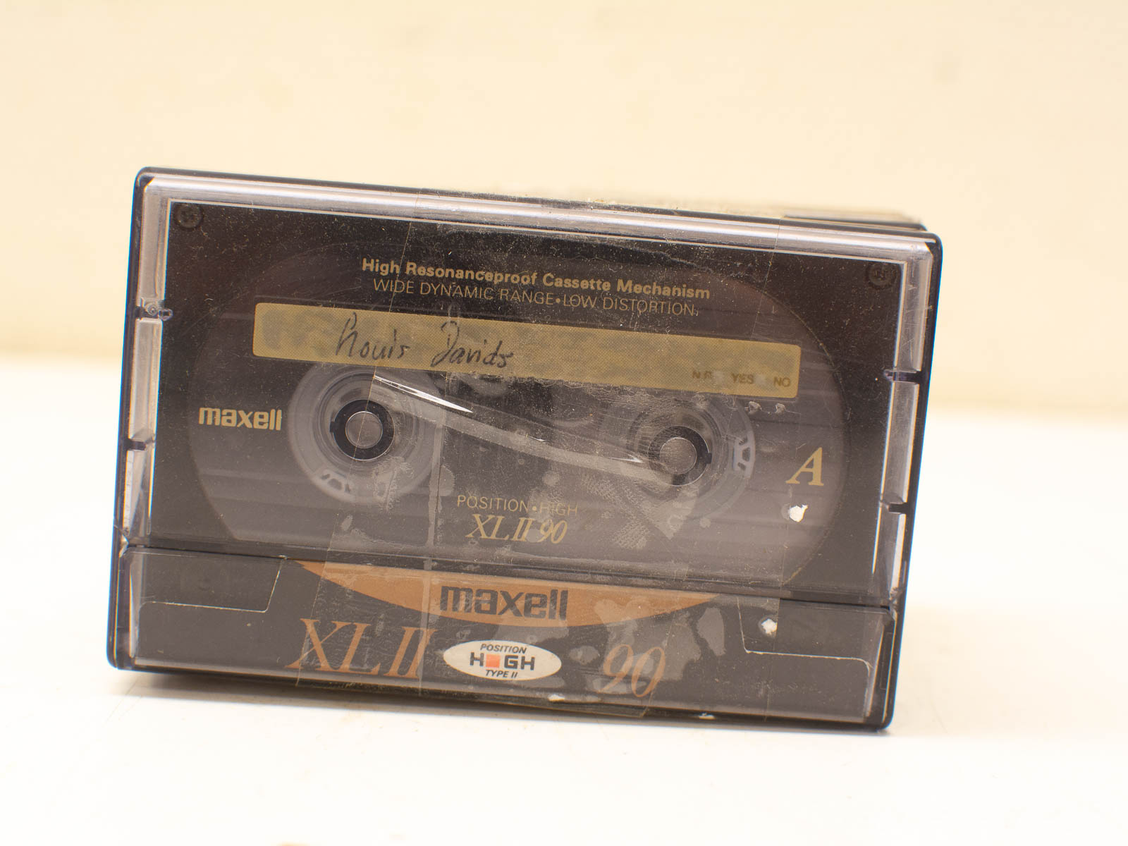 Vintage Maxell XL II 90 audio cassette featuring handwritten label and nostalgic charm.