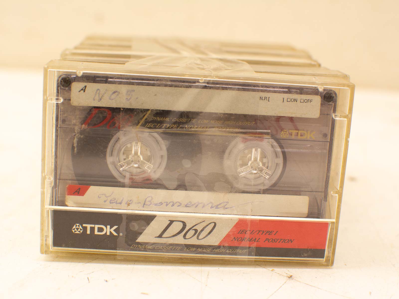 Vintage TDK D60 audio cassette with handwritten label, a nostalgic piece of retro media history.