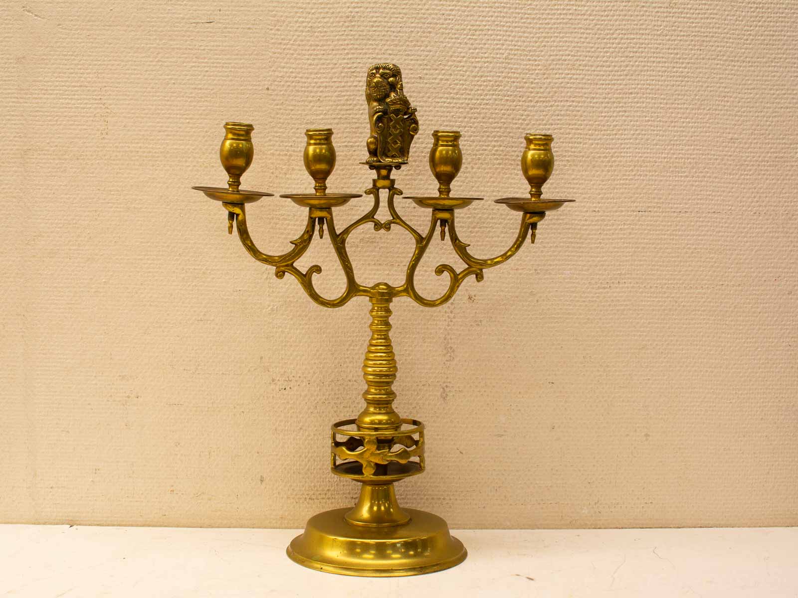 Elegant vintage brass candelabrum with intricate designs, perfect for enhancing any décor.