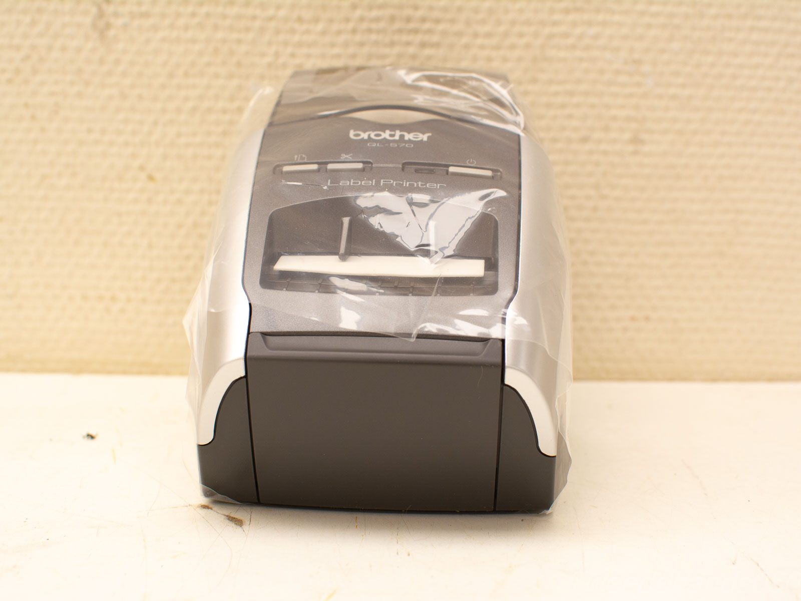 Sleek Brother label printer in black and silver for efficient organization at home or office.