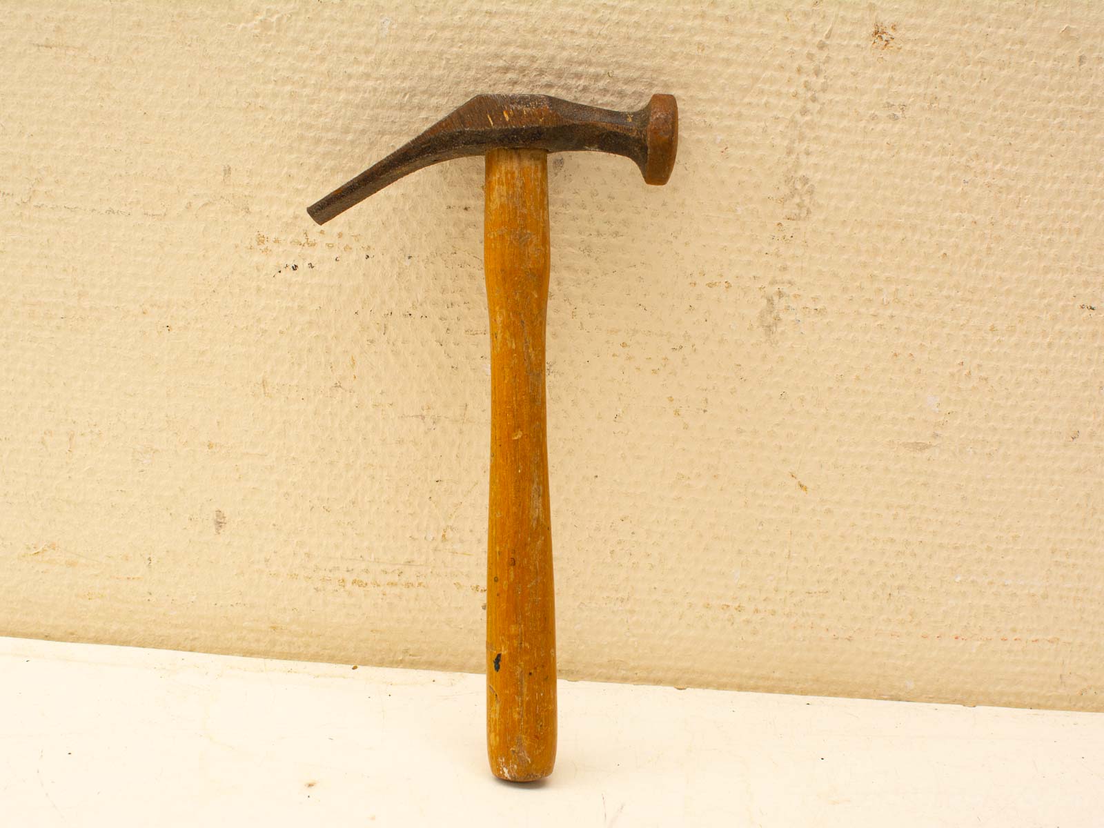 Vintage wooden claw hammer, essential tool for DIY projects and professional carpentry tasks.