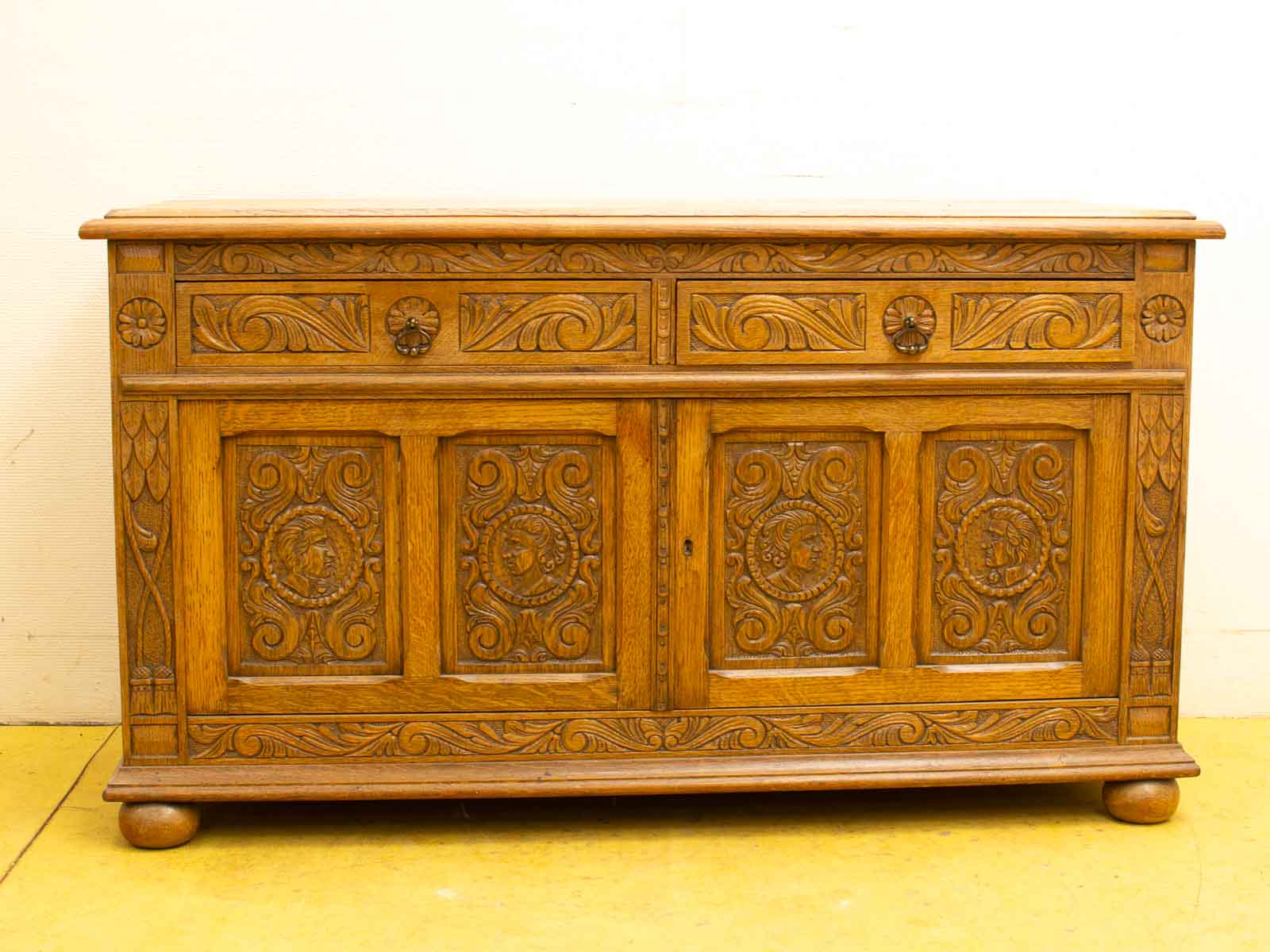 Elegant vintage wooden cabinet with intricate carvings, showcasing traditional craftsmanship and timeless charm.