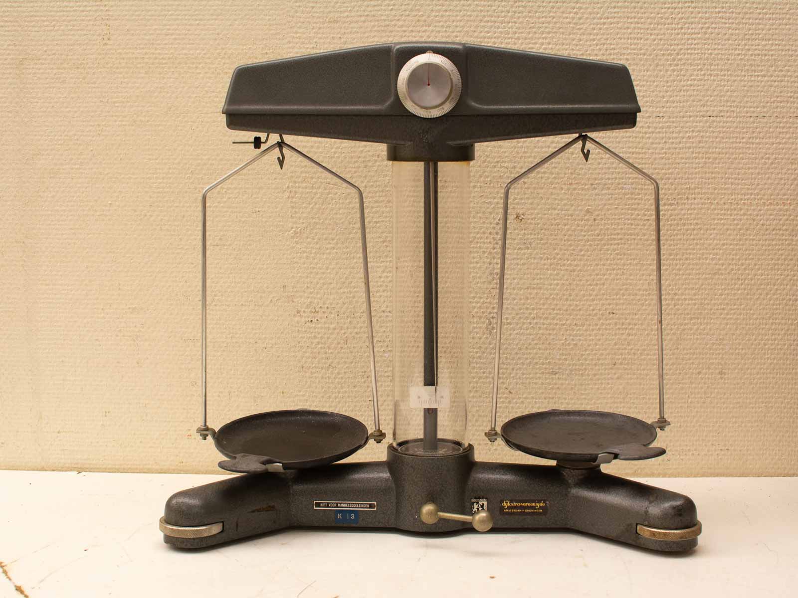 Classic vintage balance scale with dial and weighing pans for precise measurements. Perfect for collectors.