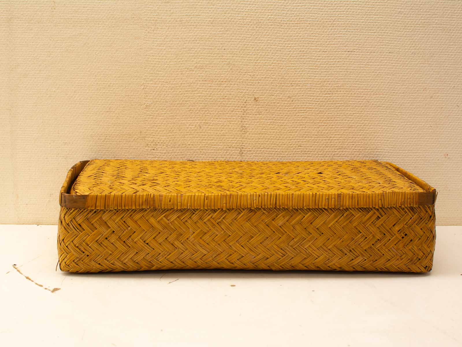 Handcrafted rectangular woven basket in golden hue, perfect for rustic and modern decor.