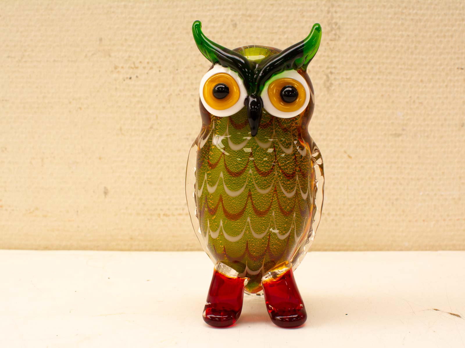 Vibrant glass owl sculpture: a charming blend of colors and craftsmanship for vintage collectors.