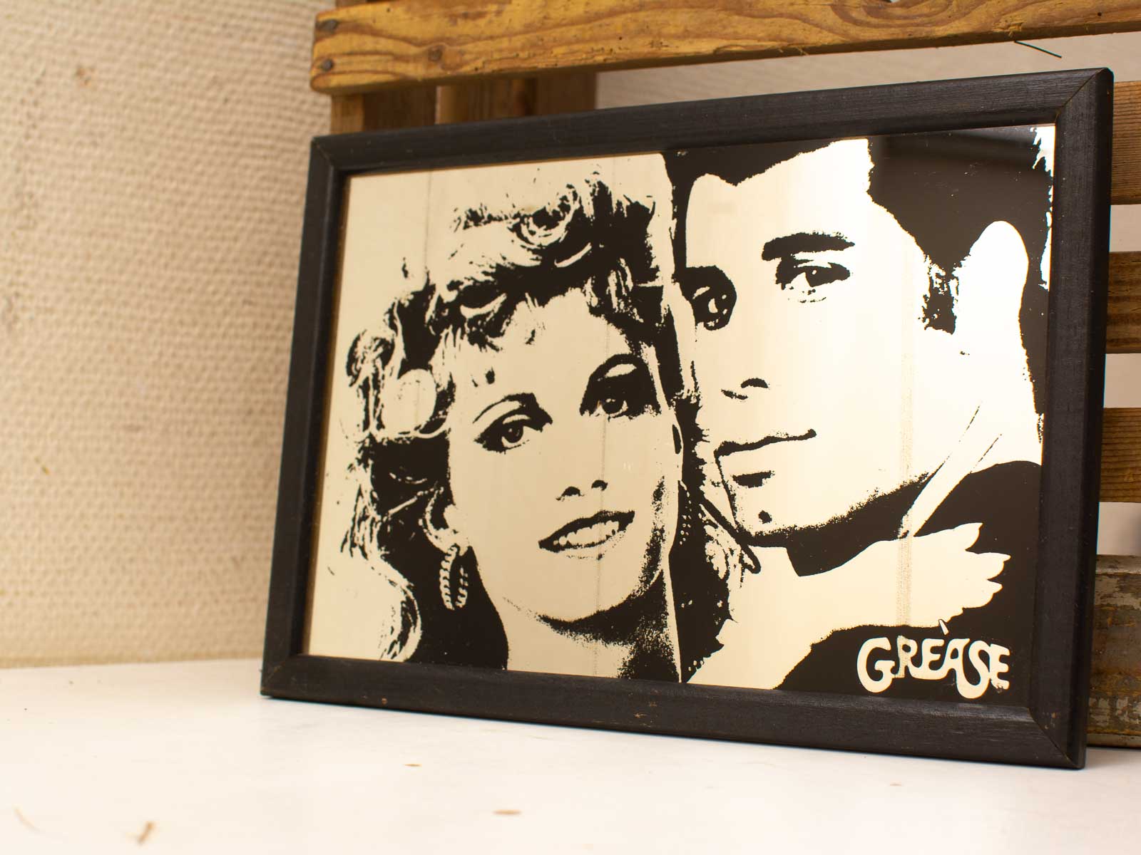 Vintage black-and-white Grease portrait highlighting iconic characters charm and nostalgic connection.