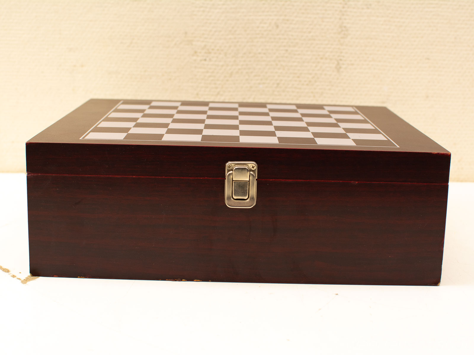 Elegant wooden chess box with a secure latch, perfect storage for chess enthusiasts.