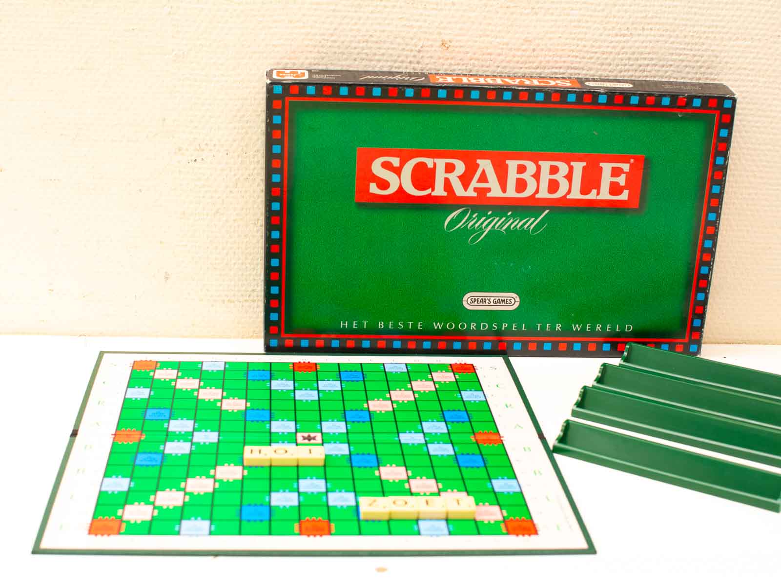 Vintage Scrabble game in green box, perfect for fun family game nights and strategic challenges.