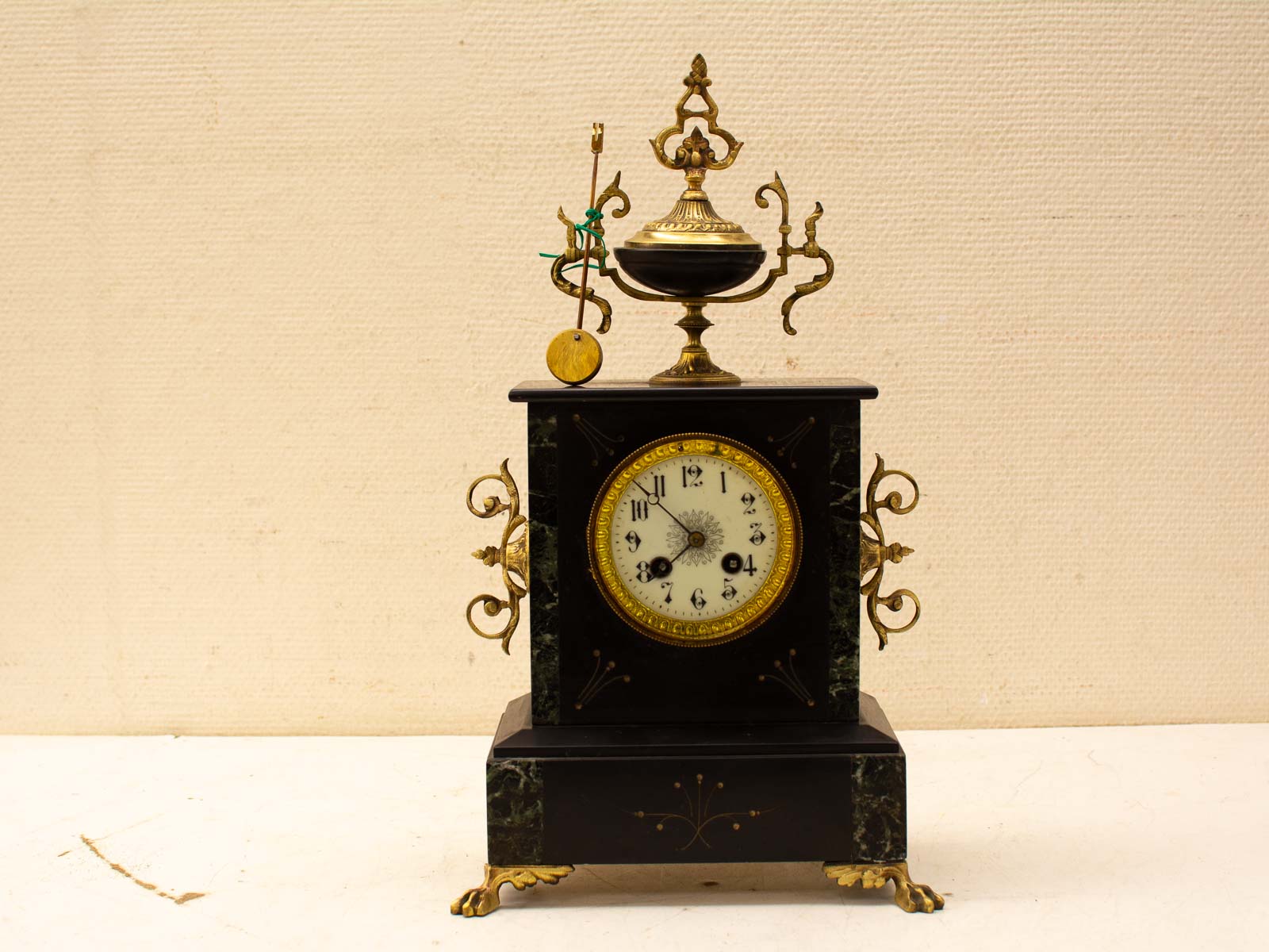 Elegant antique marble clock with green and gold accents, perfect for collectors and decor enthusiasts.