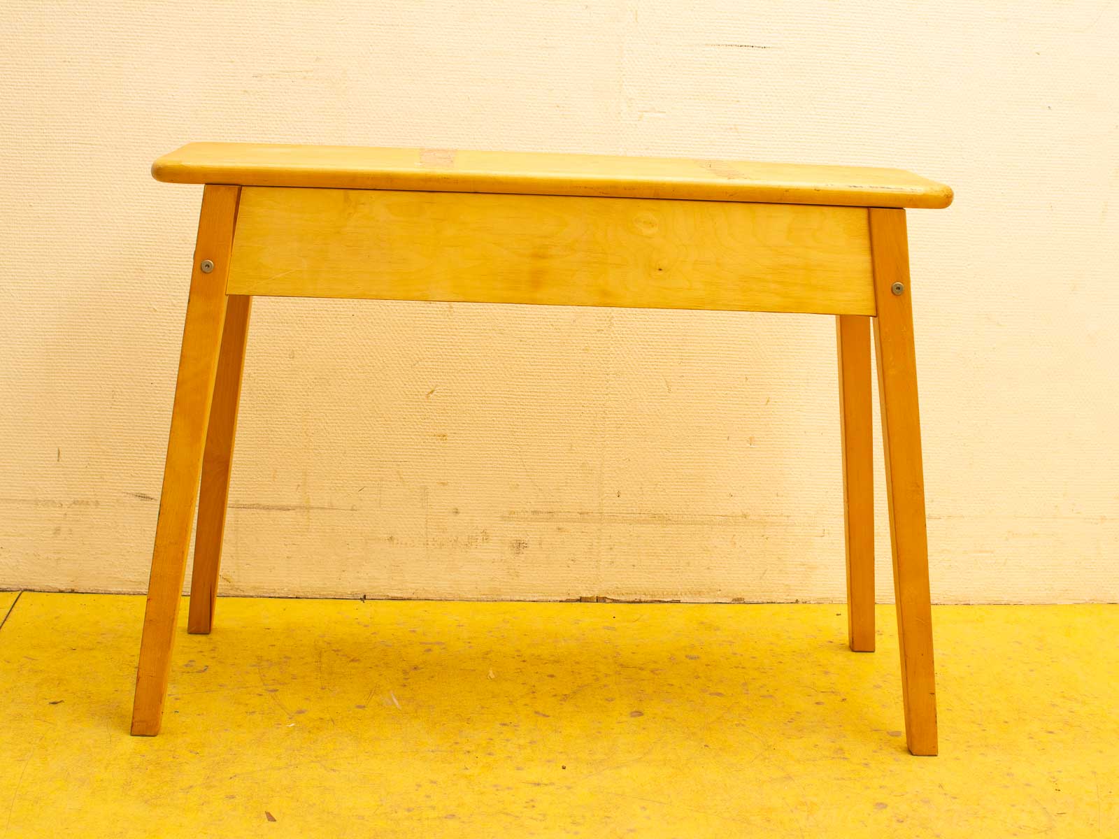 Stylish minimalist wooden table with rounded edges, perfect for modern kitchens and workspaces.