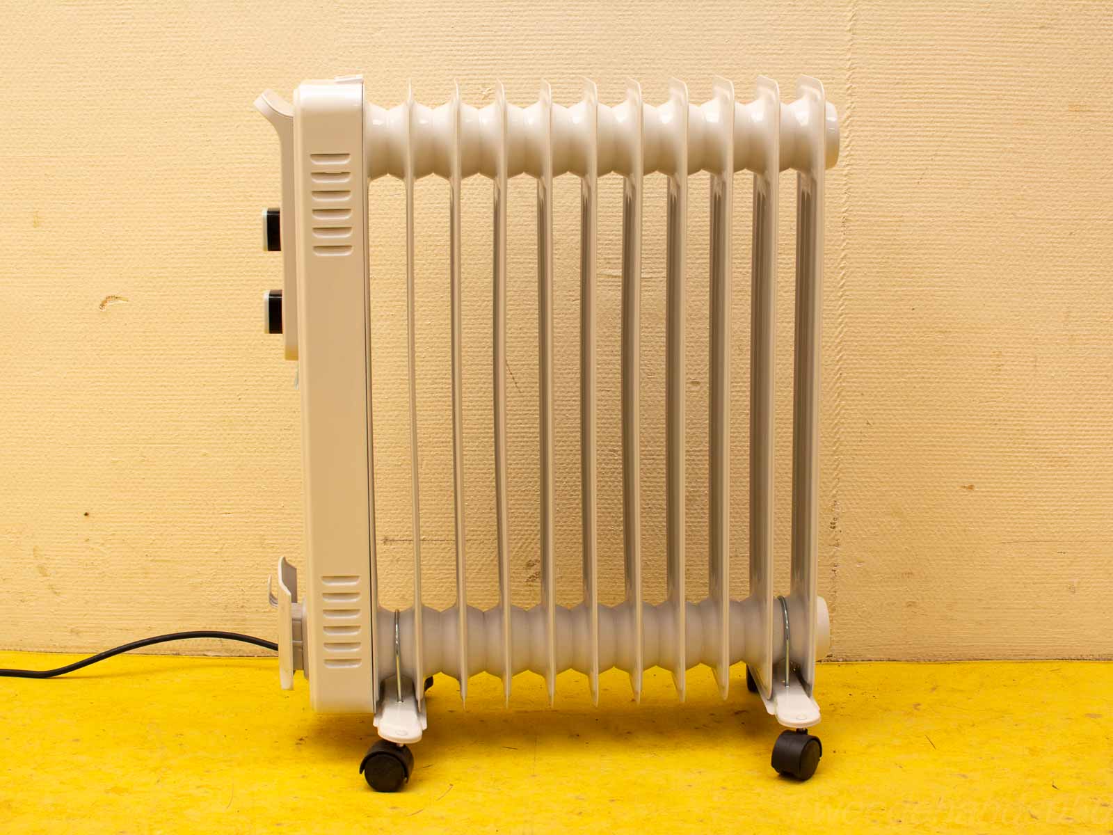 Stylish oil-filled radiator heater with wheels for easy mobility and efficient warmth.