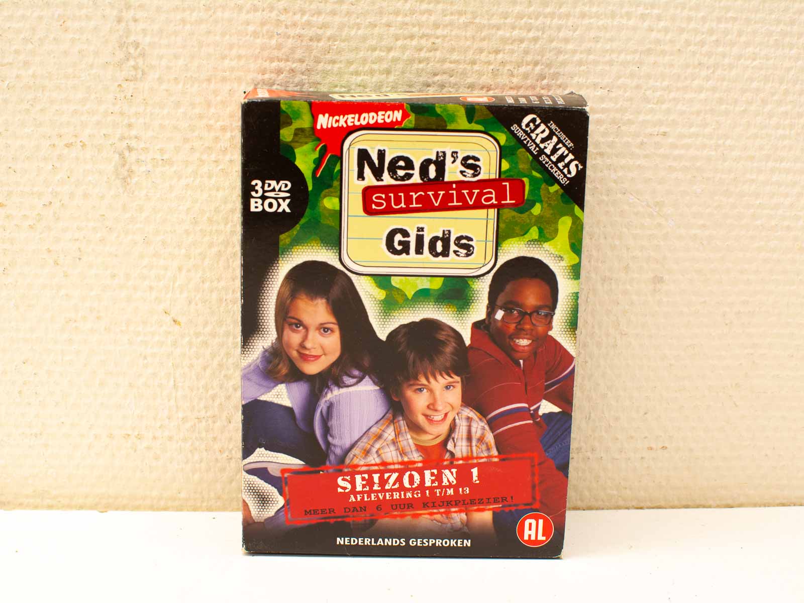 Neds Survival Gids Season 1 DVD box set with stickers for young fans.