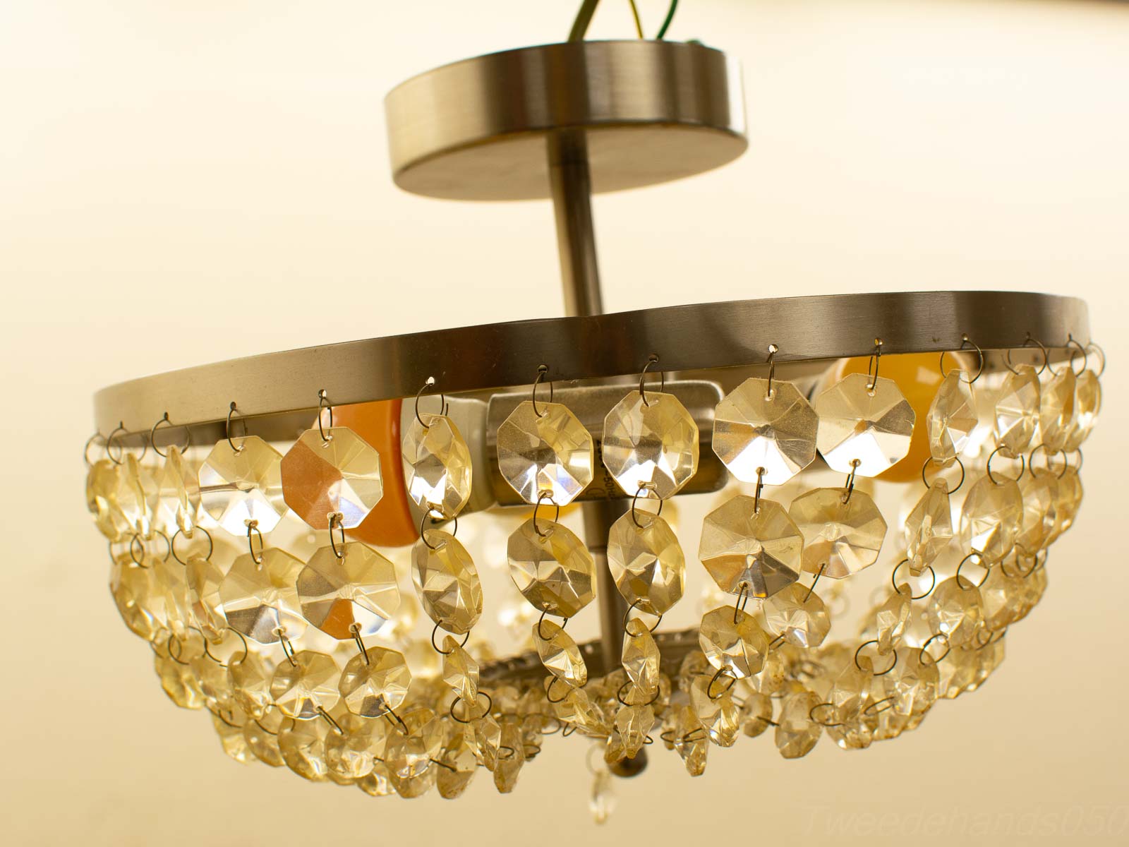 Elegant chandelier with crystals, adding timeless charm and warm ambiance to any interior space.