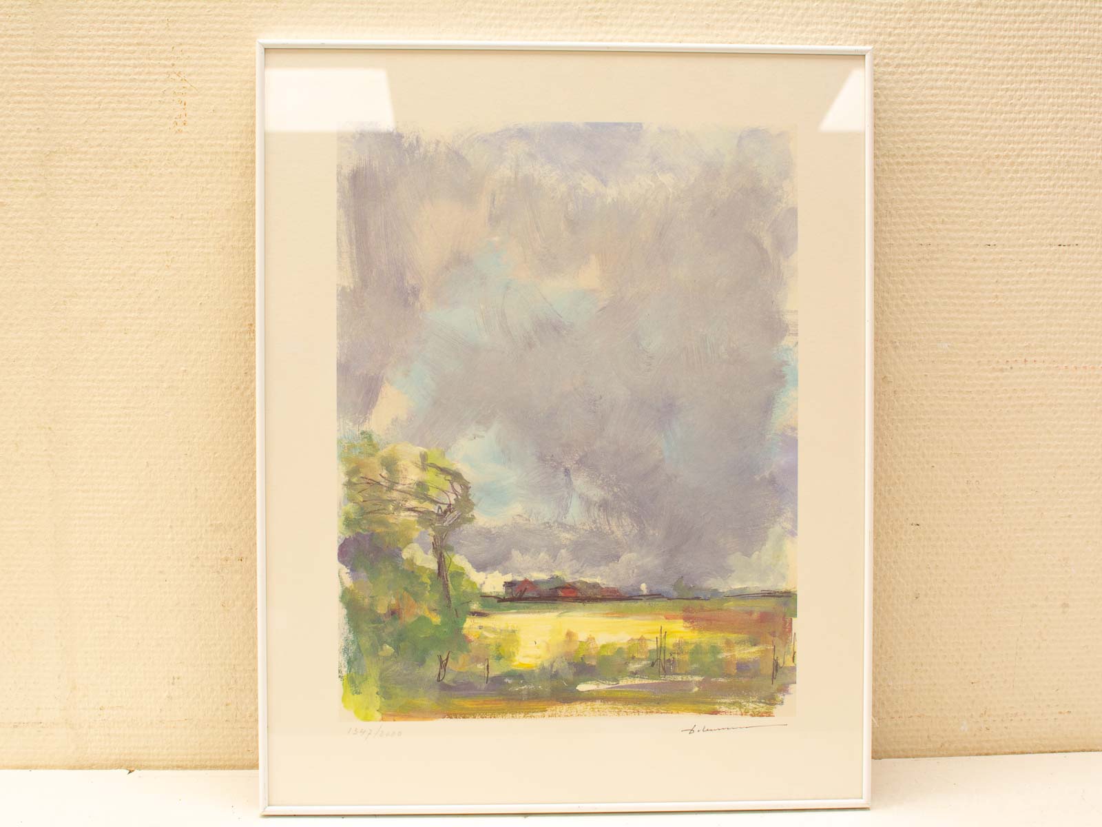 Tranquil impressionistic landscape featuring a vibrant tree against a dramatic sky.