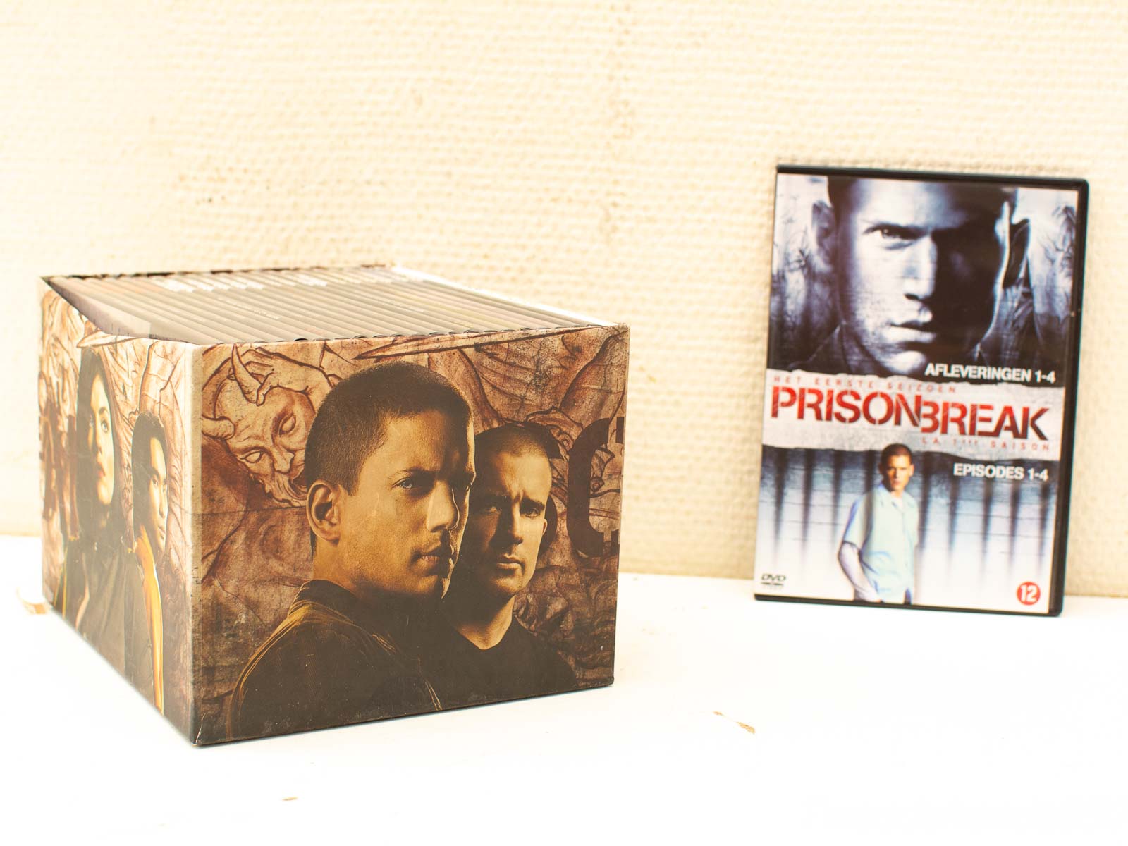 Collection of Prison Break DVDs: Complete season box set and individual episode case.