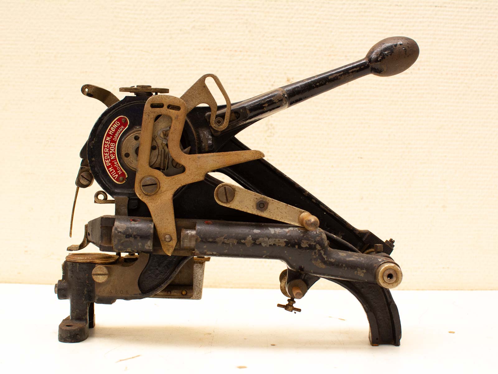 Vintage Julius Pedersen sewing machine showcasing intricate design and timeless craftsmanship from the early 20th century.