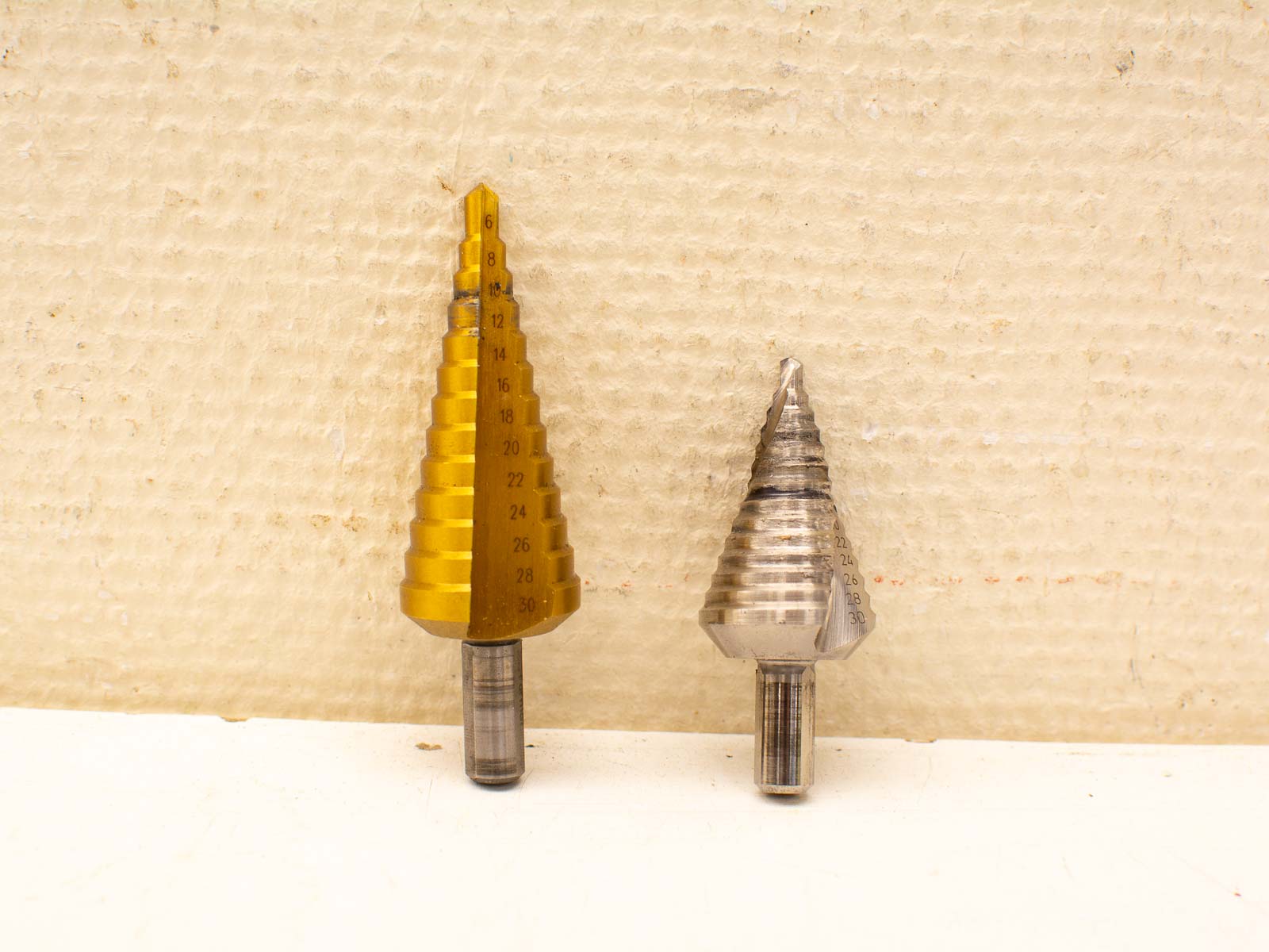 High-quality yellow and silver step drill bits for precise drilling, ideal for various projects.