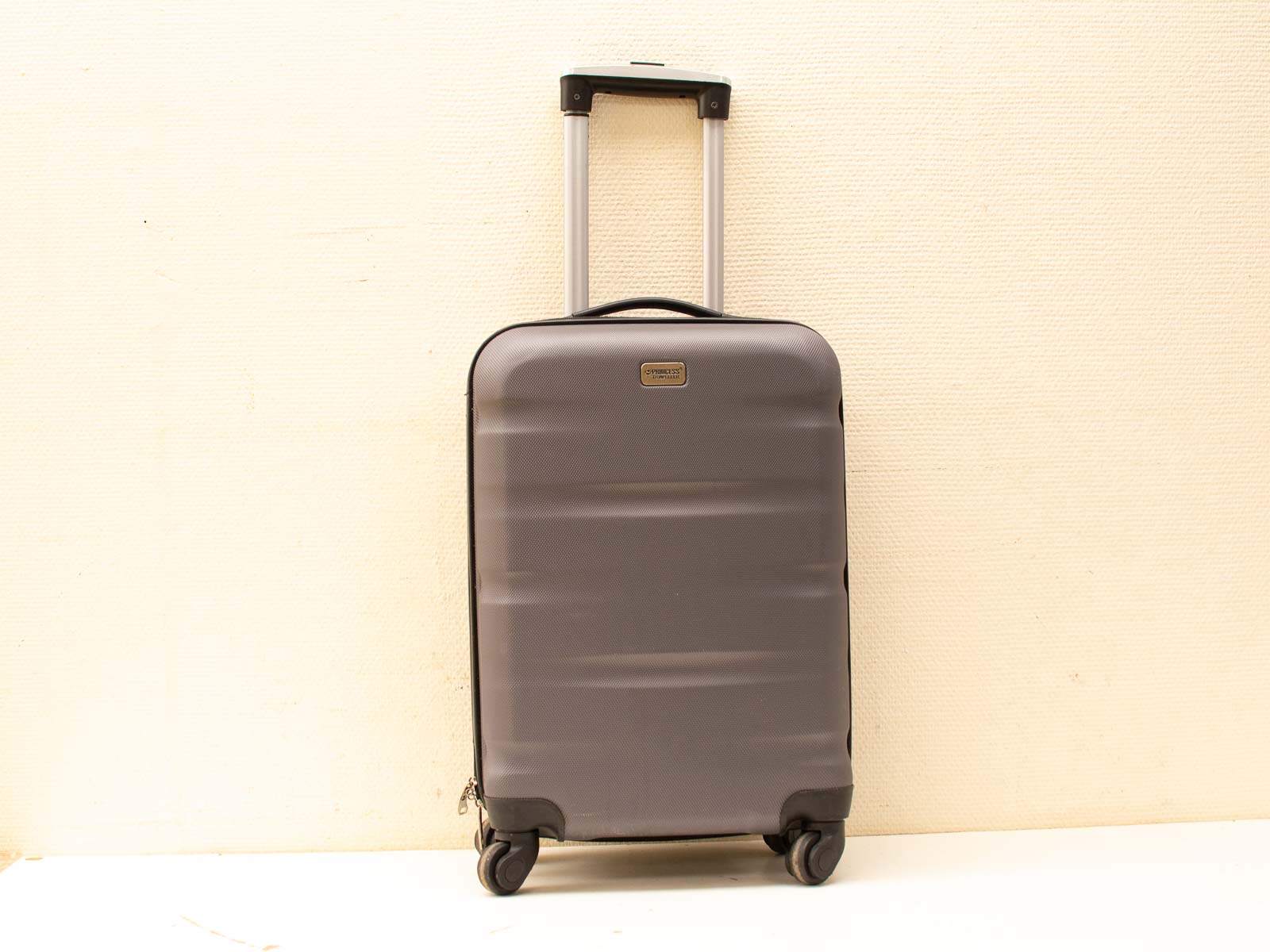 Sleek gray suitcase designed for modern travel, offering style, durability, and easy maneuverability.