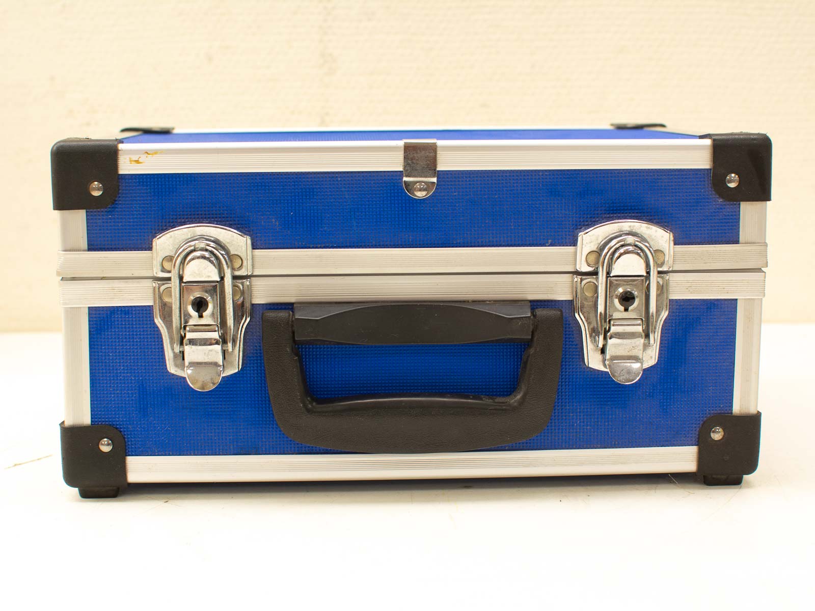 Durable blue storage case with lock and handle, perfect for safely organizing valuable items.