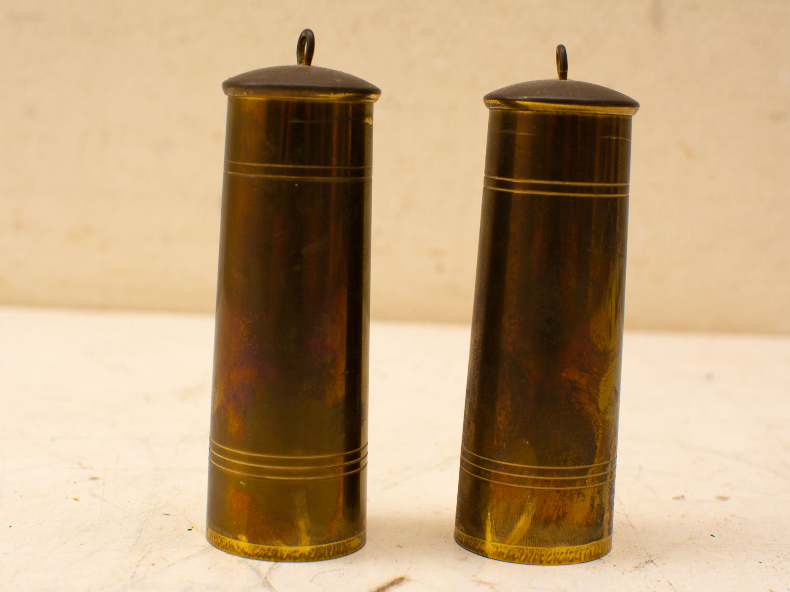 Elegant vintage brass salt and pepper shakers with classic design and charming decorative accents.