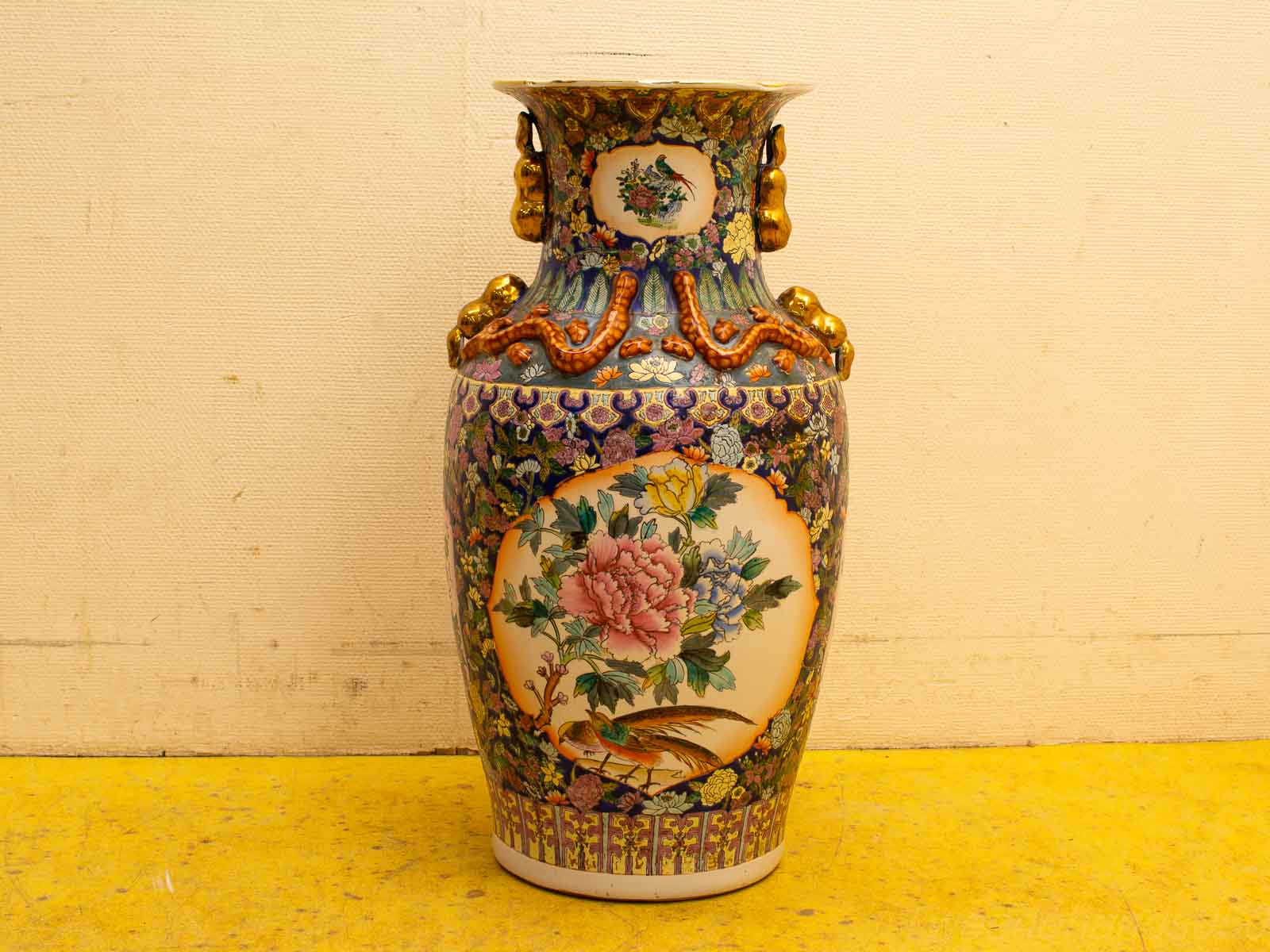 Elegant vintage vase with floral design and gold accents, perfect for collectors and decor enthusiasts.