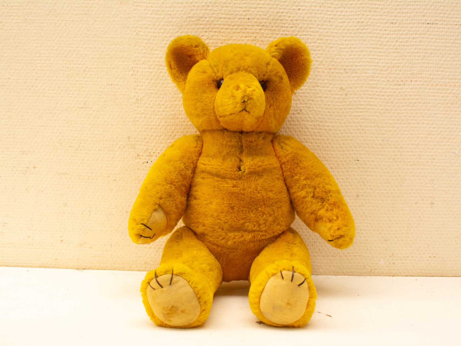 Charming yellow vintage teddy bear, soft and loveable, perfect for nostalgia and companionship.